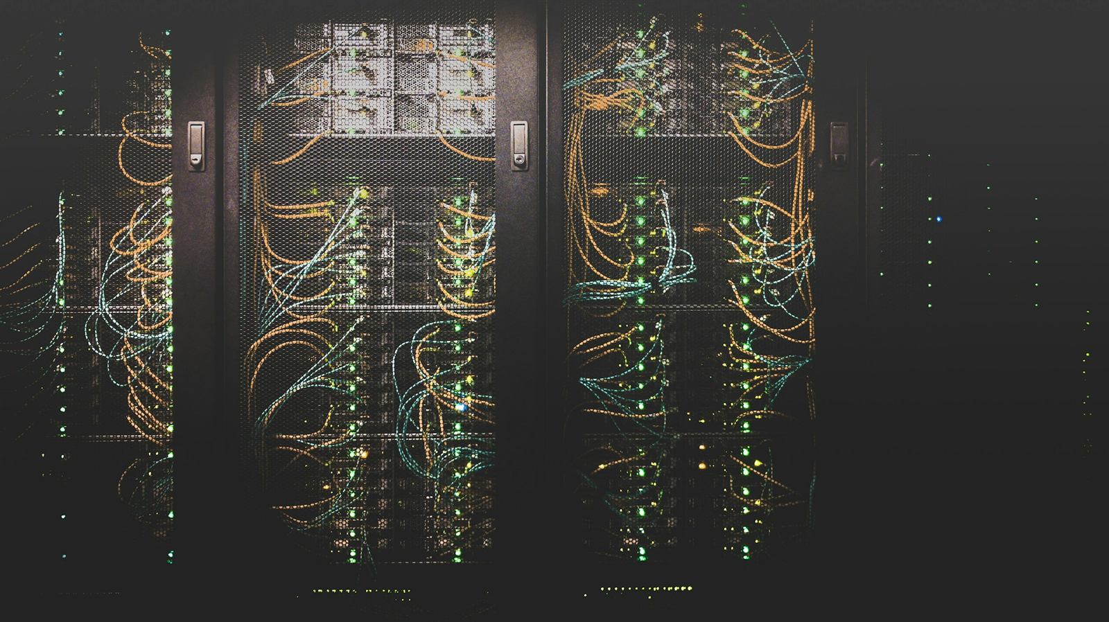 Enterprise data center — multiple rack cabinets with structured fiber cabling